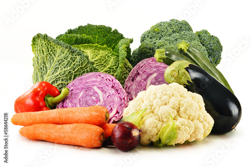 Photo: Variety of fresh organic vegetables isolated on white Variety of fresh organic vegetables isolated on white