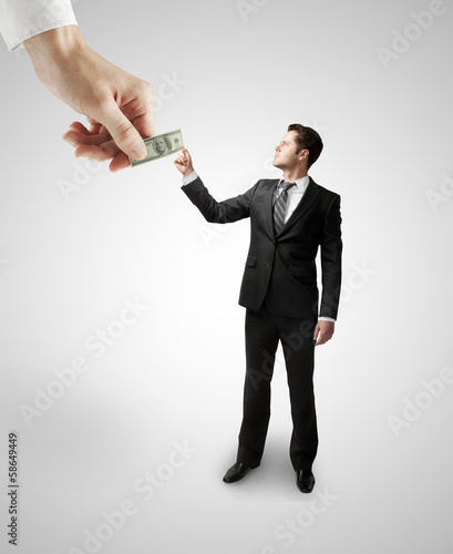 Photo: hand giving dollars hand giving dollars
