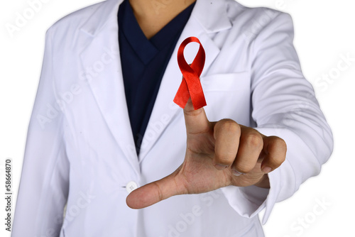 Photo: Doctor hand holding Red Ribbon Doctor hand holding Red Ribbon