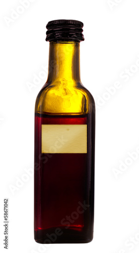 Photo: Old medicine bottle with label, isolated over white Old medicine bottle with label, isolated over white