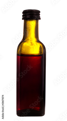 Photo: Old medicine bottle, isolated over white background Old medicine bottle, isolated over white background