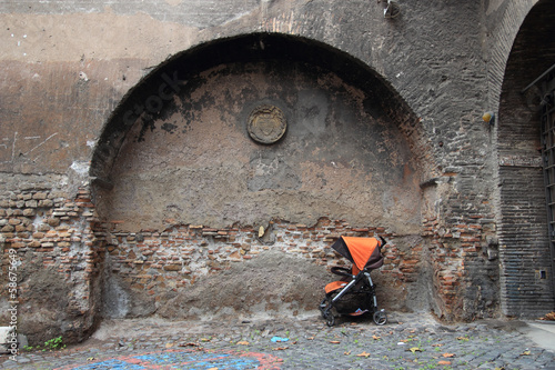 Photo: stroller over ancient wall stroller over ancient wall