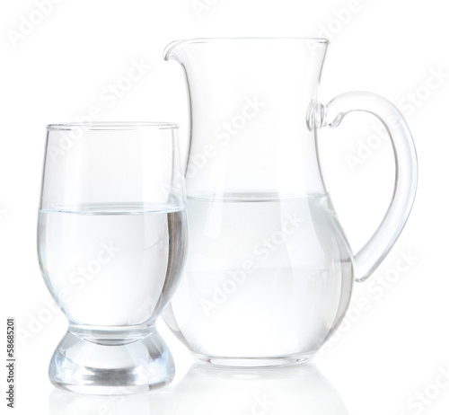 Photo: Glass pitcher of water and glass isolated on white Glass pitcher of water and glass isolated on white
