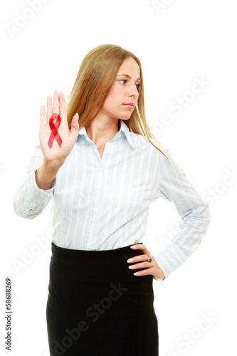 Photo: A young woman with an aids ribbon in her hand, isolated on white A young woman with an aids ribbon in her hand, isolated on white