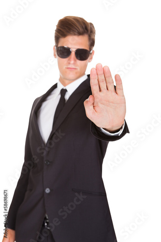 Photo: Male Spy Showing Stop Sign Male Spy Showing Stop Sign