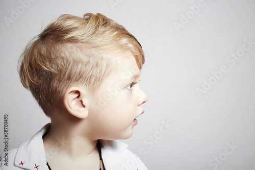 Photo: fashionable handsome little boy. stylish haircut. fashion child fashionable handsome little boy. stylish haircut. fashion child