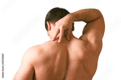 Photo: Muscular man with back neck ache isolated on white background. Muscular man with back neck ache isolated on white background.