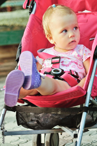 Photo: baby in red stroller baby in red stroller