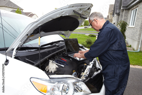 Photo: Car mechanic. Car mechanic.
