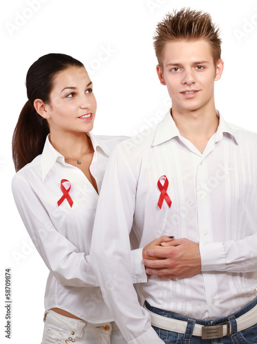 Photo: Couple with red AIDS isolated on white background Couple with red AIDS isolated on white background