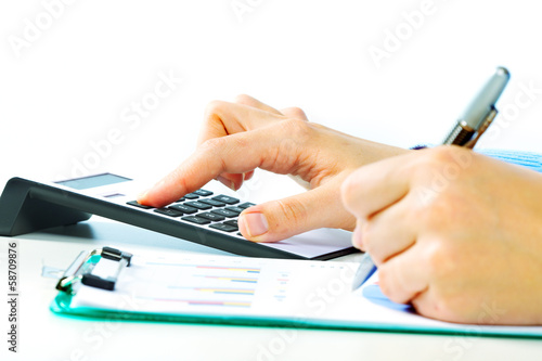 Photo: Hands with calculator. Hands with calculator.