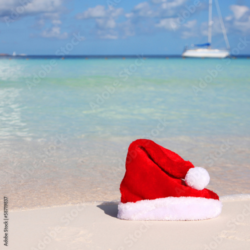 Photo: Santa's Hat on Tropical Beach Santa's Hat on Tropical Beach