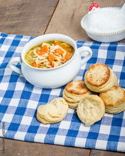 Photo: Chicken soup and biscuits on table Chicken soup and biscuits on table
