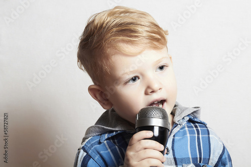 Photo: little boy singing in microphone.child karaoke.fashion haircut little boy singing in microphone.child karaoke.fashion haircut