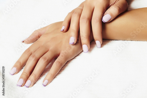Photo: manicure.female hands.in beauty salon.woman.shellac polish manicure.female hands.in beauty salon.woman.shellac polish