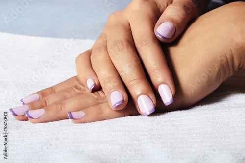Photo: manicure.female hands.in beauty salon.woman.shellac polish manicure.female hands.in beauty salon.woman.shellac polish