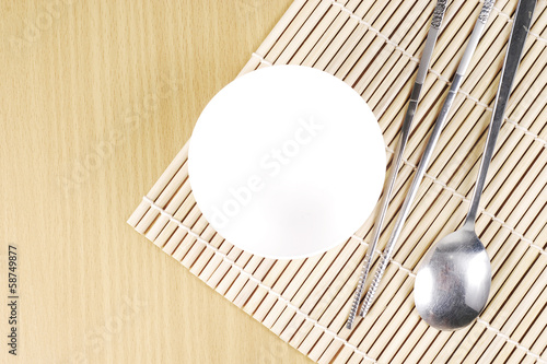Photo: Asian dish place setting on bamboo mat, Korean style Asian dish place setting on bamboo mat, Korean style