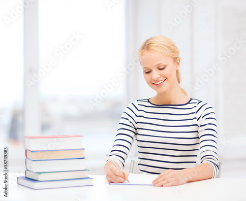 Photo: smiling woman studying in college smiling woman studying in college