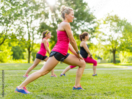 Photo: Jogging coach streching with clients Jogging coach streching with clients