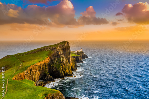 Photo: Colorful ocean coast sunset at Neist point lighthouse, Scotland Colorful ocean coast sunset at Neist point lighthouse, Scotland
