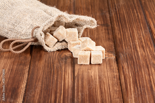 Photo: brown sugar on a old wooden table brown sugar on a old wooden table