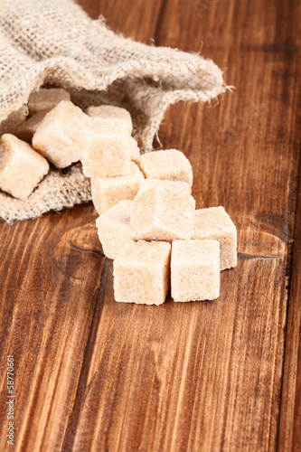 Photo: brown sugar on a old wooden table brown sugar on a old wooden table