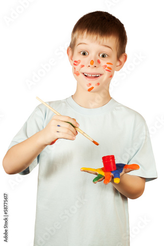 Photo: smiling happy boy with stained coloured hand smiling happy boy with stained coloured hand