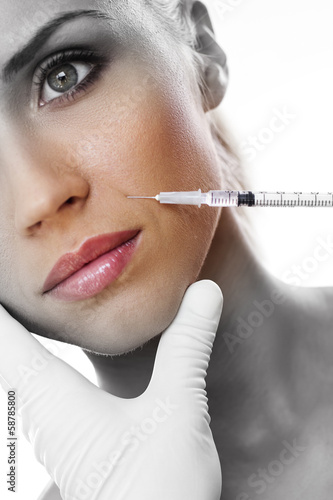 Photo: Cosmetic injection to the pretty woman face Cosmetic injection to the pretty woman face