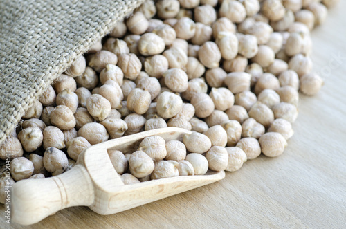 Photo: Chickpeas in a wooden spoon and bag Chickpeas in a wooden spoon and bag