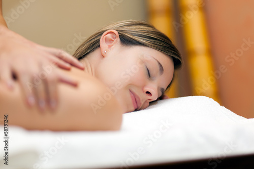 Photo: Woman having a massage Woman having a massage