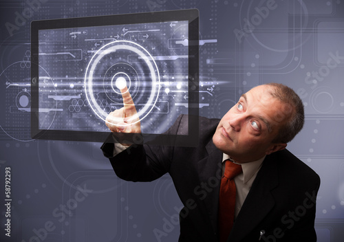 Photo: Businessman touching modern technology tablet Businessman touching modern technology tablet