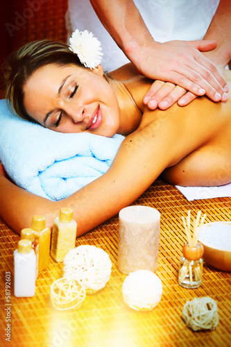 Photo: Beautiful woman having massage. Beautiful woman having massage.