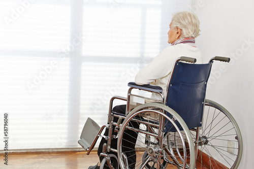 Photo: Lonely senior woman in wheelchair Lonely senior woman in wheelchair