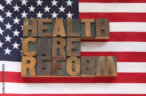 Photo: health care reform in wood type on flag health care reform in wood type on flag
