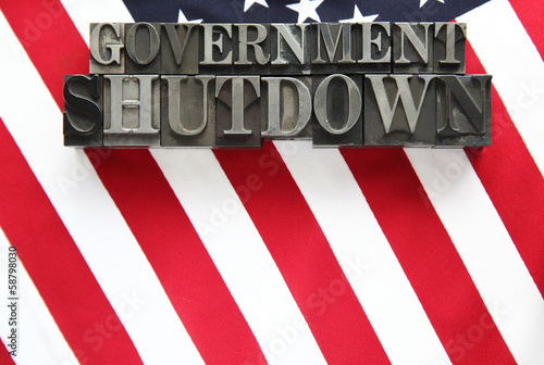 Photo: USA flag with government shutdown words in metal type USA flag with government shutdown words in metal type
