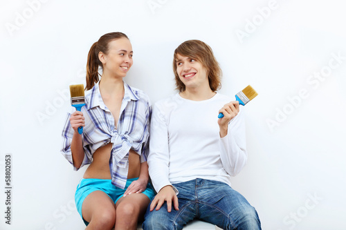 Photo: Couple with paint brushes Couple with paint brushes