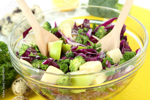 Photo: Fresh vegetable salad in bowl isolated on white Fresh vegetable salad in bowl isolated on white