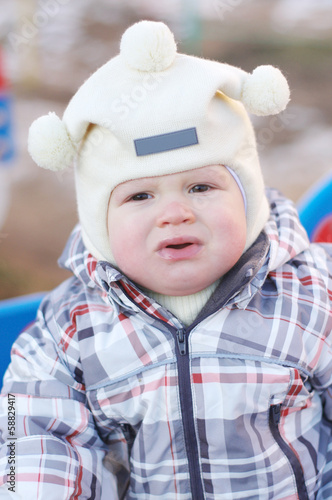 Photo: portrait of crying baby outdoors portrait of crying baby outdoors