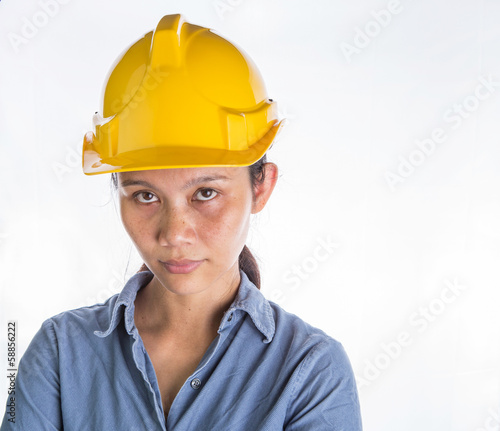 Photo: Asian female construction worker with safety hat Asian female construction worker with safety hat