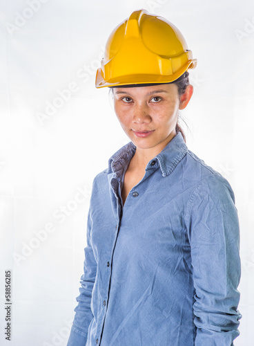 Photo: Asian female construction worker with safety hat Asian female construction worker with safety hat