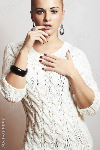 Photo: Beautiful woman in woolen dress.accessories.flirt.fashion Beautiful woman in woolen dress.accessories.flirt.fashion