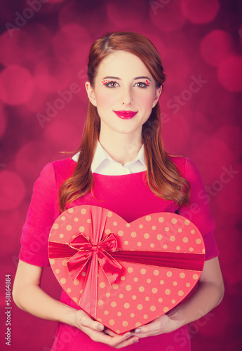 Photo: Redhead girl with shape heart box. Redhead girl with shape heart box.