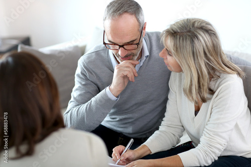 Photo: Senior couple meeting financial adviser for investment Senior couple meeting financial adviser for investment