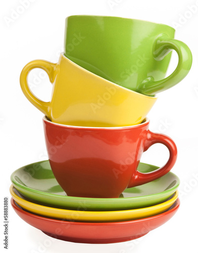Photo: stack of multicolored tea cups and saucers stack of multicolored tea cups and saucers