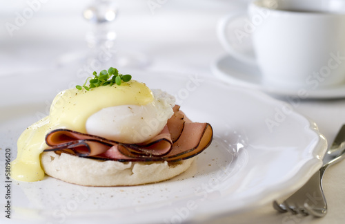 Photo: Eggs Benedict with ham and hollandaise sauce. Eggs Benedict with ham and hollandaise sauce.