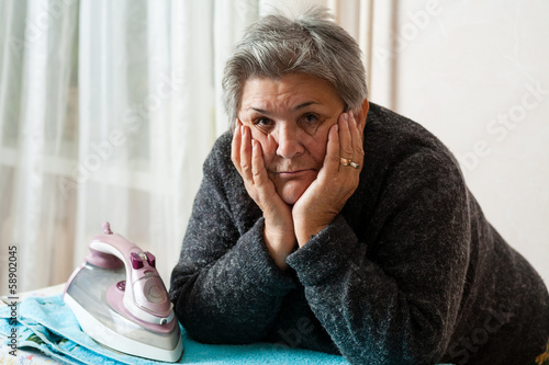 Photo: senior women iron clothes senior women iron clothes