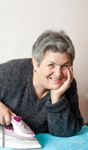 Photo: senior women iron clothes senior women iron clothes