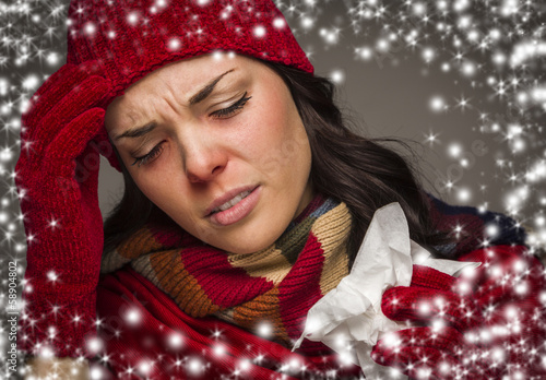 Photo: Sick Woman with Tissue and Snow Effect Surrounding Sick Woman with Tissue and Snow Effect Surrounding