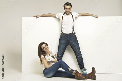 Photo: Picture of young attractive couple with rabbit Picture of young attractive couple with rabbit