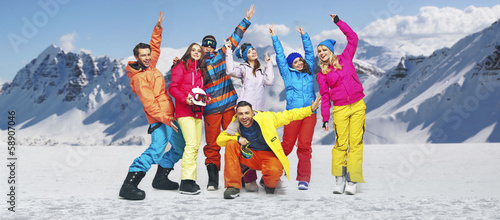 Photo: Smiling snowboarders in funny poses Smiling snowboarders in funny poses